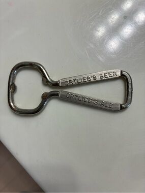 Vintage wire-loop advertising bottle opener from the Henry F. Ortlieb Brewing Co
